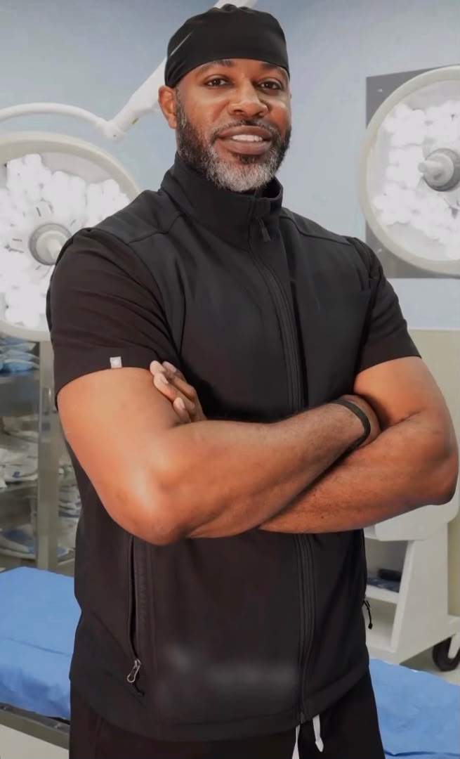 Dr. Clifton smiling in the surgical suite